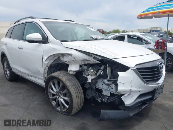 2015 Mazda CX-9 Grand Touring z VIN JM3TB2DV9F0458340, wystawiony jako IAAI lot #42021843 z przebiegiem 145 929 mil mil oraz . Historia ofert i sprzedaży dostępna na DreamBid. Obrazek 1.