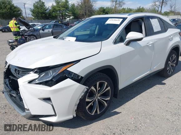2018 Lexus RX 350 with VIN 2T2BZMCA2JC164234, listed as a IAAI auction lot 42030641 with 74,160 mi miles and . Bid and sale history available at DreamBid. Image 2.
