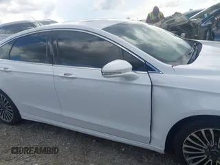 2017 Ford Fusion Titanium z VIN 3FA6P0K93HR203063, wystawiony jako IAAI lot #42243064 z przebiegiem 176 078 mil mil oraz . Historia ofert i sprzedaży dostępna na DreamBid. Obrazek 14.