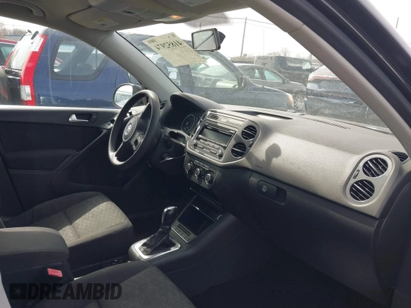 2012 Volkswagen Tiguan SE with VIN WVGAV7AXXCW526403, listed as a IAAI auction lot 41852974 with 125,376 mi miles and . Bid and sale history available at DreamBid. Image 5.