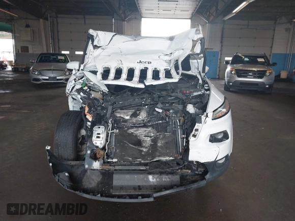2015 Jeep Cherokee Latitude with VIN 1C4PJMCBXFW784869, listed as a IAAI auction lot 41951297 with 138,396 mi miles. Bid and sale history available at carsss.com. Image 12.