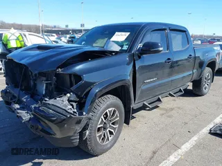2021 Toyota Tacoma 4WD SR5 with VIN 3TMDZ5BN4MM117564, listed as a IAAI auction lot 41629220 with 77,063 mi miles. Bid and sale history available at carsss.com. Image 18.