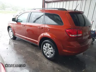 2014 Dodge Journey SE with VIN 3C4PDCAB1ET227003, listed as a IAAI auction lot 42143105 with 212,334 mi miles. Bid and sale history available at carsss.com. Image 3.