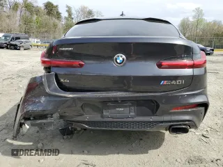 2019 BMW X4 M40i with VIN 5UXUJ5C5XKLJ64004, listed as a Copart auction lot 52106895 with 74,599 mi miles and Salvage title. Bid and sale history available at DreamBid. Image 6.