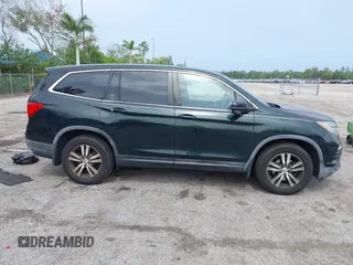 2017 Honda Pilot EX-L with VIN 5FNYF6H50HB033968, listed as a IAAI auction lot 42400720 with 119,597 mi miles and . Bid and sale history available at DreamBid. Image 13.