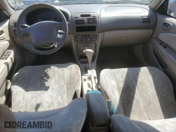 1998 Toyota Corolla VE with VIN 1NXBR18E6WZ080700, listed as a Copart auction lot 58605135 with 214,928 mi miles and Salvage title. Bid and sale history available at DreamBid. Image 8.