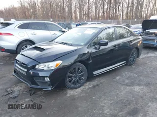 2015 Subaru WRX with VIN JF1VA1A60F9831858, listed as a IAAI auction lot 41360764 with 99,199 mi miles. Bid and sale history available at carsss.com. Image 2.