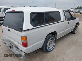 1990 Mitsubishi Mighty Max with VIN JA7FL24W6LP031144, listed as a IAAI auction lot 42152666 with 212,104 mi miles and . Bid and sale history available at DreamBid. Image 4.