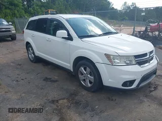 2012 Dodge Journey SXT z VIN 3C4PDCBG2CT134580, wystawiony jako IAAI lot #42281399 z przebiegiem 137 070 mil mil oraz . Historia ofert i sprzedaży dostępna na DreamBid. Obrazek 1.
