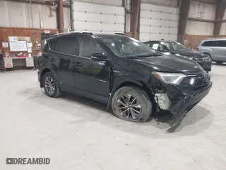 2017 Toyota RAV4 Hybrid XLE with VIN JTMRJREV7HD073092, listed as a IAAI auction lot 42021031 with 207,967 mi miles. Bid and sale history available at carsss.com. Image 1.