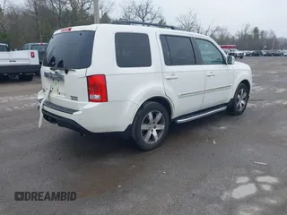 2013 Honda Pilot Touring with VIN 5FNYF4H95DB011661, listed as a IAAI auction lot 42101104 with 298,004 mi miles and . Bid and sale history available at carsss.com. Image 4.