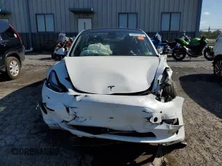 2023 Tesla Model 3 with VIN 5YJ3E1EA5PF567354, listed as a Copart auction lot 60964725 with 60,962 mi miles and Salvage title. Bid and sale history available at DreamBid. Image 5.