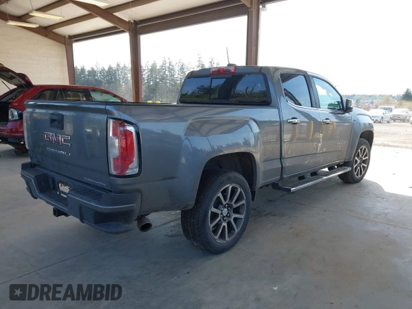 2021 GMC Canyon 4WD Denali with VIN 1GTG6EEN5M1102747, listed as a IAAI auction lot 42121134 with 60,412 mi miles and . Bid and sale history available at DreamBid. Image 4.