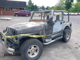 2000 Jeep Wrangler Sport with VIN 1J4FA49S5YP797345, listed as a IAAI auction lot 40322775 with Not Provided miles and . Bid and sale history available at DreamBid. Image 13.