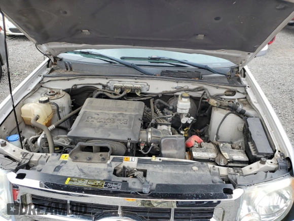 2010 Ford Escape Limited with VIN 1FMCU0EG9AKA54244, listed as a Copart auction lot 56930955 with 88,496 mi miles and Salvage title. Bid and sale history available at DreamBid. Image 12.