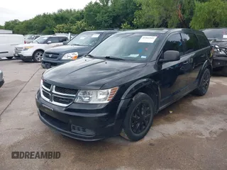 2013 Dodge Journey SE z VIN 3C4PDCAB6DT709917, wystawiony jako IAAI lot #42361943 z przebiegiem 196 891 mil mil oraz . Historia ofert i sprzedaży dostępna na DreamBid. Obrazek 2.