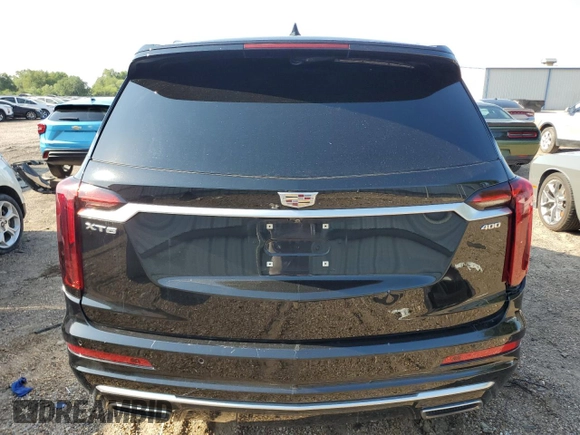 2020 Cadillac XT6 FWD Premium Luxury с VIN 1GYKPCRSXLZ174002, выставлен на аукционе Copart как лот 52083235 с пробегом 79 712 миль миль и Списание • Salvage title. История ставок и продаж доступна на DreamBid. Изображение 6.