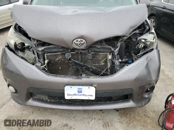 2014 Toyota Sienna SE с VIN 5TDXK3DC1ES519741, выставлен на аукционе Copart как лот 53892035 с пробегом Не указан миль и Списание • Salvage title. История ставок и продаж доступна на DreamBid. Изображение 12.