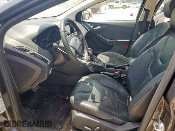 2017 Ford Focus Titanium with VIN 1FADP3J20HL253446, listed as a Copart auction lot 64196895 with 150,633 mi miles and Salvage title. Bid and sale history available at DreamBid. Image 7.