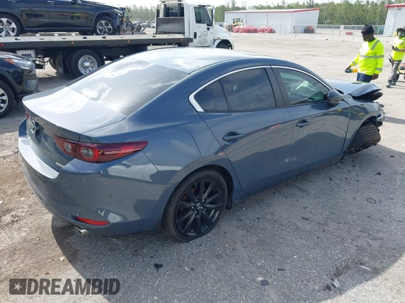 2024 Mazda 3 S Carbon Edition with VIN 3MZBPBCM2RM403824, listed as a IAAI auction lot 42612315 with 8,261 mi miles and . Bid and sale history available at DreamBid. Image 4.