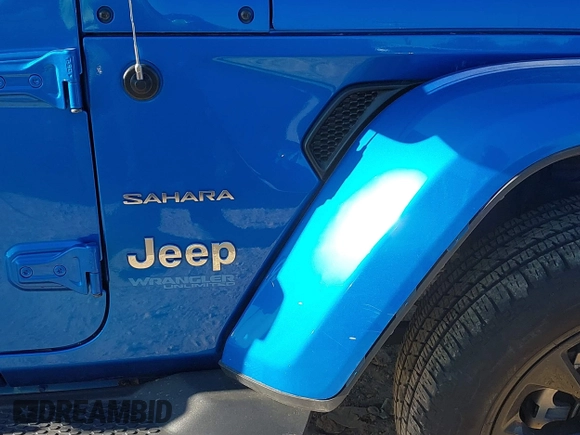 2022 Jeep Wrangler Unlimited Sahara with VIN 1C4JJXP64NW192452, listed as a IAAI auction lot 41631295 with 23,738 mi miles and . Bid and sale history available at DreamBid. Image 6.