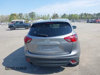2014 Mazda CX-5 Touring with VIN JM3KE2CY9E0310315, listed as a IAAI auction lot 41943991 with 98,359 mi miles and . Bid and sale history available at carsss.com. Image 16.
