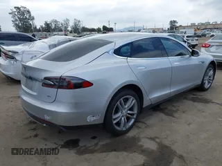 2013 Tesla Model S with VIN 5YJSA1DG7DFP11382, listed as a IAAI auction lot 42056169 with 126,975 mi miles. Bid and sale history available at carsss.com. Image 4.