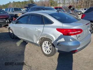 2015 Ford Focus SE with VIN 1FADP3F20FL355058, listed as a IAAI auction lot 41666337 with 144,887 mi miles. Bid and sale history available at carsss.com. Image 3.