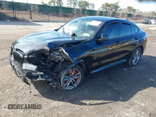 2021 BMW X4 M40i with VIN 5UX2V5C03M9H54824, listed as a IAAI auction lot 41817714 with 34,880 mi miles. Bid and sale history available at carsss.com. Image 2.