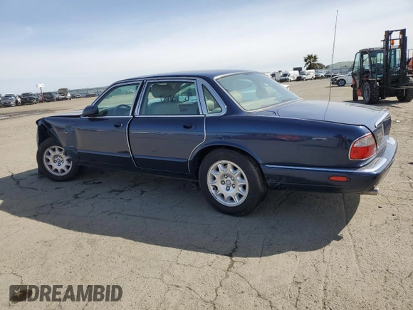 2000 Jaguar XJ with VIN SAJDA14C7YLF18873, listed as a Copart auction lot 50032495 with Not Provided miles and Salvage Title. Bid and sale history available at DreamBid. Image 2.