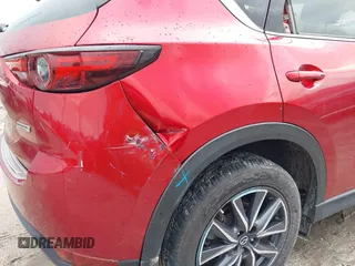 2018 Mazda CX-5 Grand Touring with VIN JM3KFADM5J0437365, listed as a IAAI auction lot 42657919 with 96,760 mi miles and . Bid and sale history available at DreamBid. Image 6.