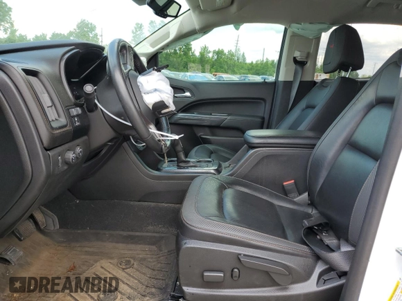 2021 GMC Canyon 4WD AT4 z VIN 1GTG6FEN9M1147406, wystawiony jako Copart lot #55454634 z przebiegiem 82 898 mil mil oraz Szkody całkowita. Historia ofert i sprzedaży dostępna na DreamBid. Obrazek 7.