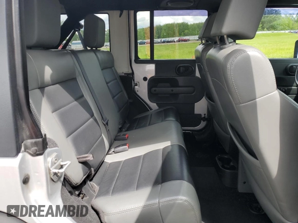 2010 Jeep Wrangler Unlimited Rubicon with VIN 1J4BA6H18AL222429, listed as a Copart auction lot 58348815 with 80,317 mi miles and Salvage title. Bid and sale history available at DreamBid. Image 11.