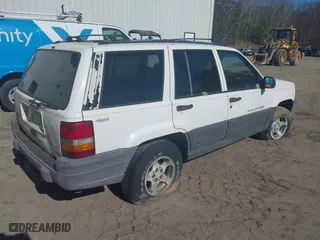 1996 Jeep Grand Cherokee Laredo with VIN 1J4GZ58Y7TC381600, listed as a IAAI auction lot 42065681 with 1 mi miles. Bid and sale history available at carsss.com. Image 4.