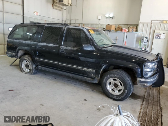 1999 Chevrolet Suburban with VIN 1GNGK26J6XJ444189, listed as a Copart auction lot 68249474 with 216,412 mi miles and Salvage Title. Bid and sale history available at carsss.com. Image 4.