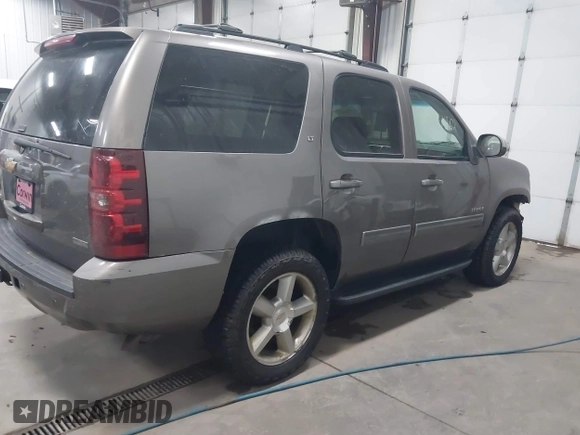 2011 Chevrolet Tahoe LT with VIN 1GNSKBE03BR268246, listed as a IAAI auction lot 41434862 with 250,991 mi miles and . Bid and sale history available at DreamBid. Image 4.