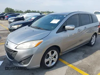 2014 Mazda 5 Sport z VIN JM1CW2BL9E0165101, wystawiony jako IAAI lot #42280068 z przebiegiem 147 336 mil mil oraz . Historia ofert i sprzedaży dostępna na DreamBid. Obrazek 2.