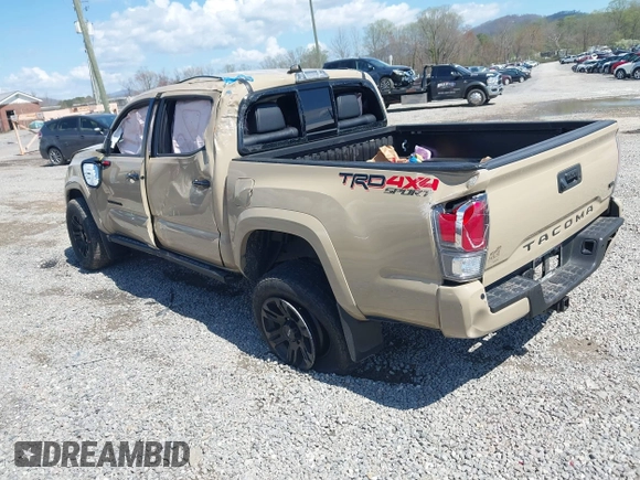 2020 Toyota Tacoma SR5 z VIN 3TMCZ5AN1LM300447, wystawiony jako IAAI lot #41961434 z przebiegiem 42 090 mil mil oraz . Historia ofert i sprzedaży dostępna na DreamBid. Obrazek 3.