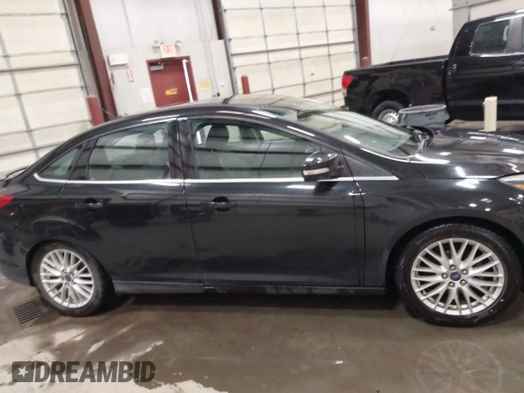 2014 Ford Focus Titanium with VIN 1FADP3J22EL199563, listed as a IAAI auction lot 41450106 with 129,271 mi miles. Bid and sale history available at carsss.com. Image 13.