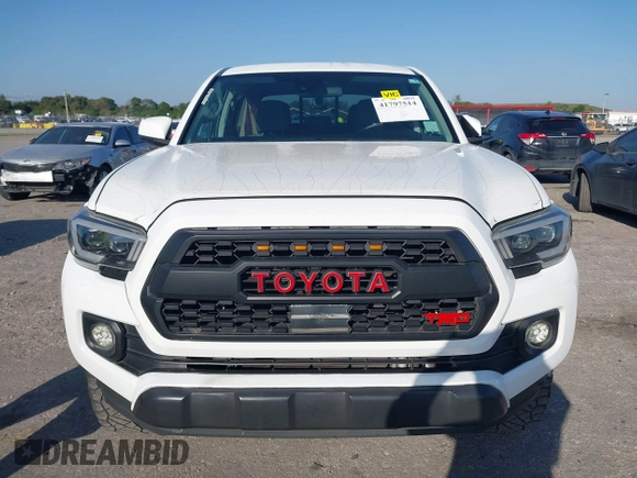 2018 Toyota Tacoma SR with VIN 5TFAX5GN2JX128621, listed as a IAAI auction lot 41797514 with 216,251 mi miles and . Bid and sale history available at DreamBid. Image 12.