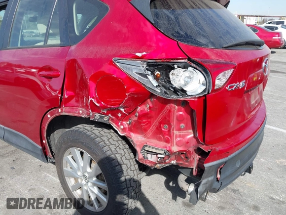 2016 Mazda CX-5 Sport with VIN JM3KE2BY4G0701442, listed as a IAAI auction lot 41682335 with 125,624 mi miles. Bid and sale history available at carsss.com. Image 6.