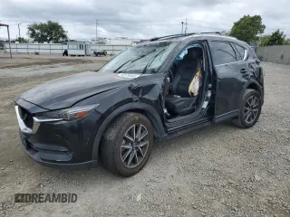 2018 Mazda CX-5 Grand Touring with VIN JM3KFADM3J1370114, listed as a Copart auction lot 54579585 with 65,513 mi miles and Salvage Title. Bid and sale history available at DreamBid. Image 1.