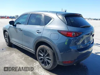 2021 Mazda CX-5 Touring with VIN JM3KFACM1M0317763, listed as a IAAI auction lot 41775712 with 75,068 mi miles. Bid and sale history available at carsss.com. Image 3.