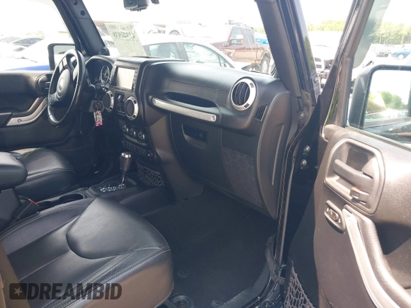2014 Jeep Wrangler Unlimited Sahara with VIN 1C4BJWEG0EL273086, listed as a IAAI auction lot 42340938 with 121,448 mi miles and . Bid and sale history available at DreamBid. Image 5.