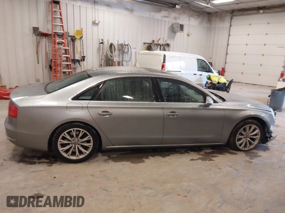 2012 Audi A8 with VIN WAURVAFD7CN021716, listed as a IAAI auction lot 42330229 with 97,359 mi miles and . Bid and sale history available at DreamBid. Image 13.