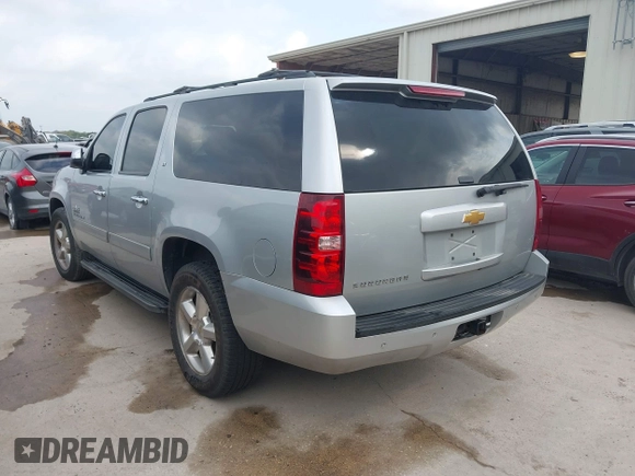 2013 Chevrolet Suburban LT with VIN 1GNSCJE03DR164477, listed as a IAAI auction lot 42083985 with 150,540 mi miles and . Bid and sale history available at DreamBid. Image 3.