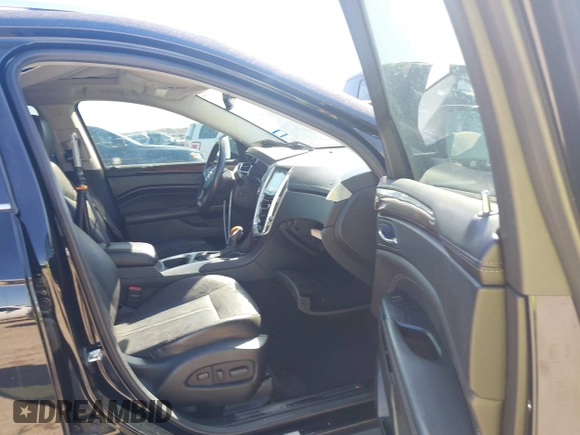 2014 Cadillac SRX Performance Collection z VIN 3GYFNCE35ES517868, wystawiony jako IAAI lot #41775522 z przebiegiem 166 960 mil mil oraz . Historia ofert i sprzedaży dostępna na DreamBid. Obrazek 5.