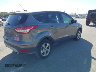 2014 Ford Escape SE with VIN 1FMCU9G97EUD86213, listed as a IAAI auction lot 40515507 with 129,711 mi miles and . Bid and sale history available at carsss.com. Image 4.
