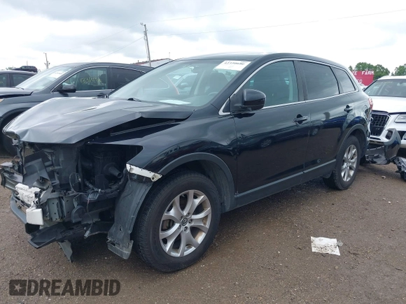 2015 Mazda CX-9 Sport with VIN JM3TB3BV1F0466070, listed as a IAAI auction lot 42350686 with 110,818 mi miles and . Bid and sale history available at DreamBid. Image 2.