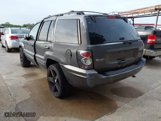 2004 Jeep Grand Cherokee Laredo with VIN 1J4GX48S14C218695, listed as a IAAI auction lot 41933611 with 158,290 mi miles. Bid and sale history available at carsss.com. Image 3.